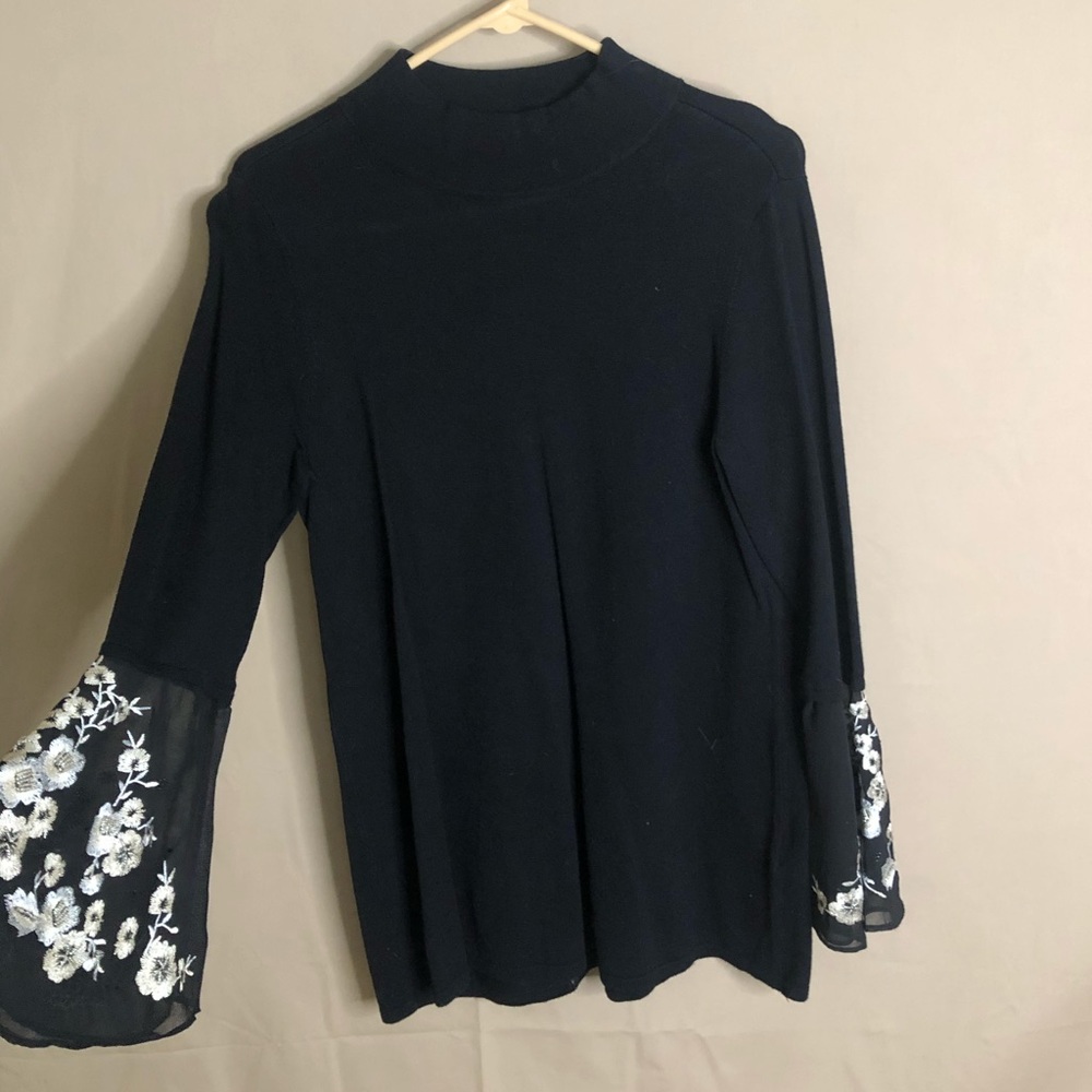 Black sweater with floral sleeves